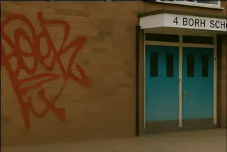 Laser graffiti removal from brick and concrete surfaces preserving original texture