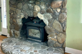 Stone fireplace and hearth after soot removal with laser cleaning