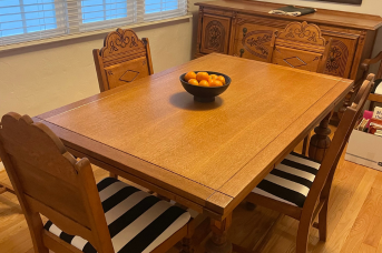 Green Bee Laser carefully cleaned and restored this carved wood dining set, preserving its natural grain, detailed craftsmanship, and warm finish.