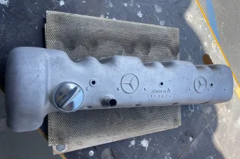 Mercedes-Benz aluminum valve cover cleaned with precision laser technology